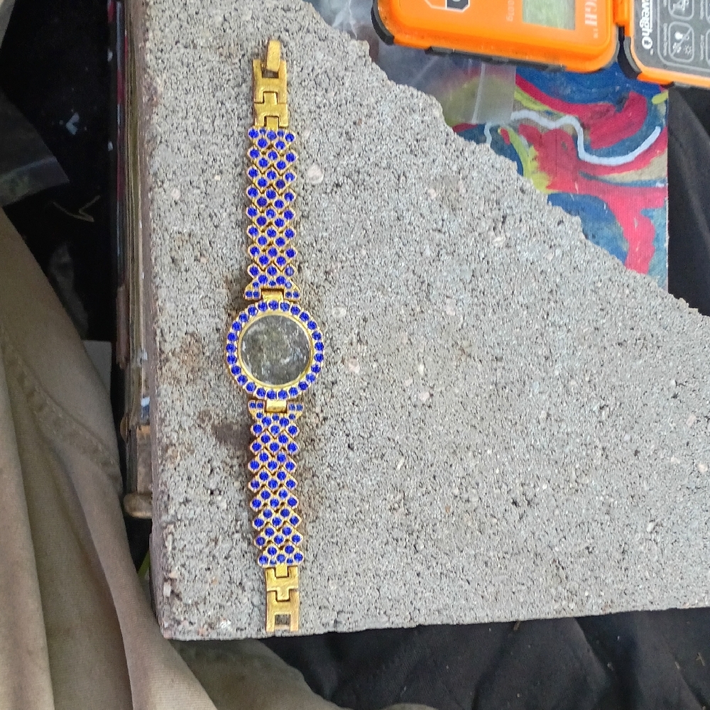 18kt Gold And Sapphire Watch Case.